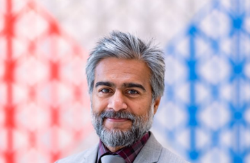 A photo of Rafiq Ajani with the AKC background 