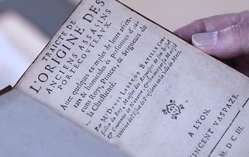 closeup of a French book about the assassin legends