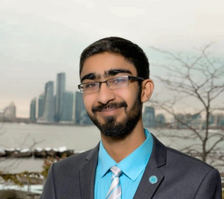 IIS student Aqil Visram in front of the Toronto skyline