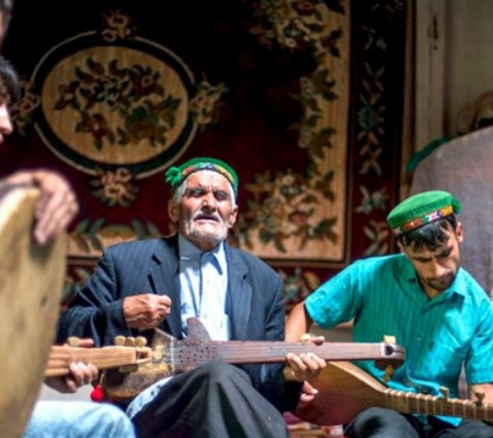 Five musical school players dressed in middle eastern attire playing diverse musical instruments with passion
