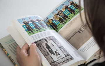 A girl reading a book (two sides of the pages with two graphics on each)