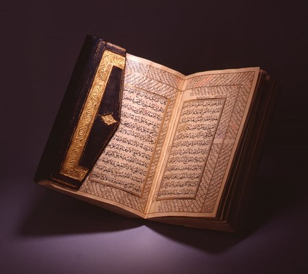 An open with two sided pages with Arabic written in them.