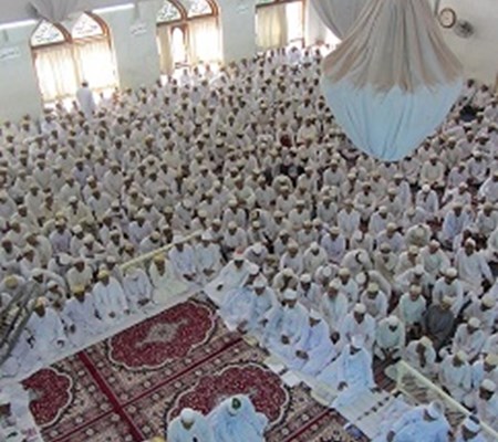 A group of people recited prayers in a prayer hall