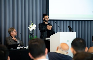 Farhan Ferozali presenting his paper in the IIS research conference 2023.