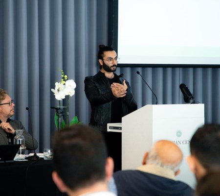 Farhan Ferozali presenting his paper in the IIS research conference 2023.