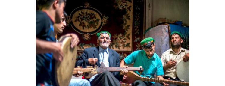Five musical school players dressed in middle eastern attire playing diverse musical instruments with passion