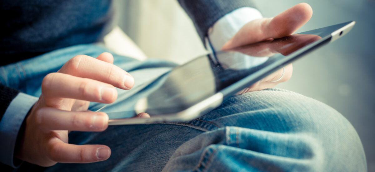 An individual working on an iPad