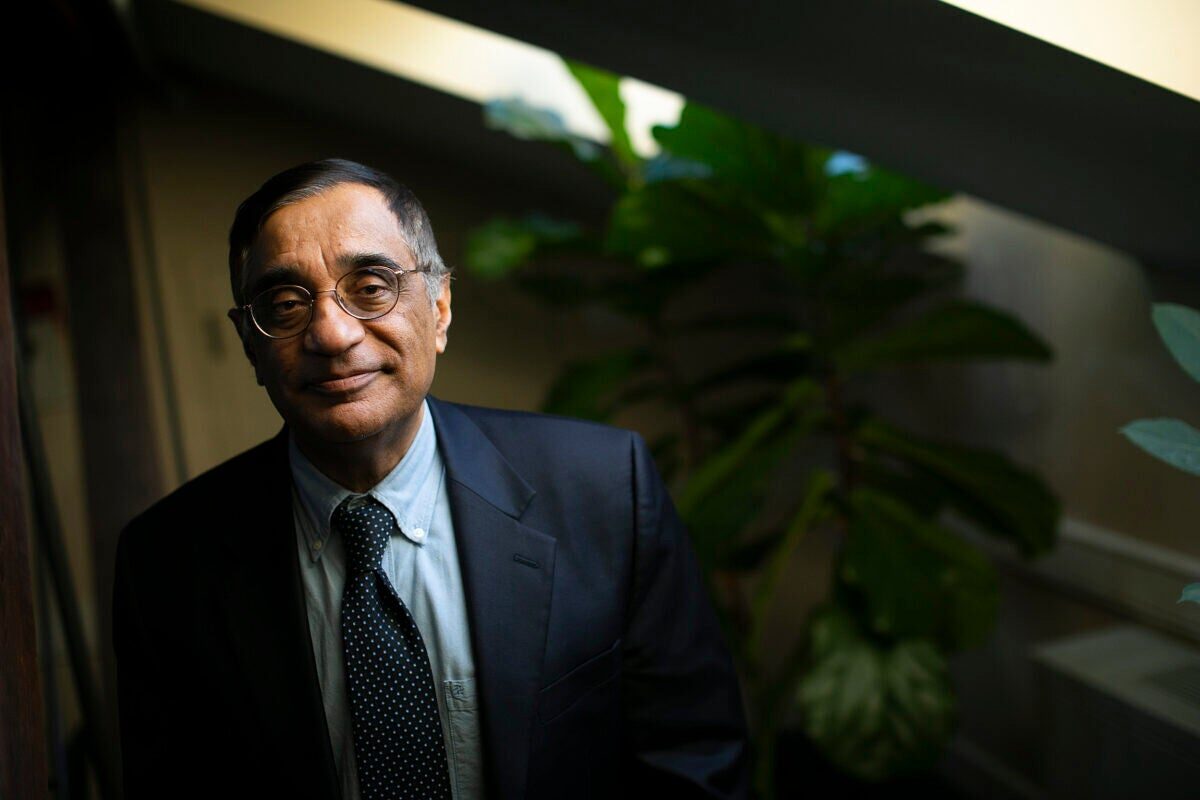 Landscape photo of Professor Ali Asani in a black suit