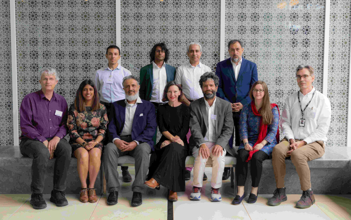 Some people from the Quran conference taking a group picture in the first floor balcony at the Aga Khan Centre