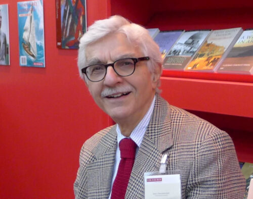 Iradj Bagherzade posing in a suit (from a library/conference)