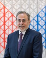 Man in suit with geometric background.