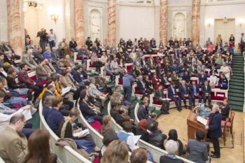 A large crowd of audience sitting in a lecture hall
