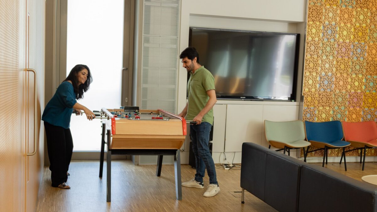 STEP students playing foosball in the student lounge.