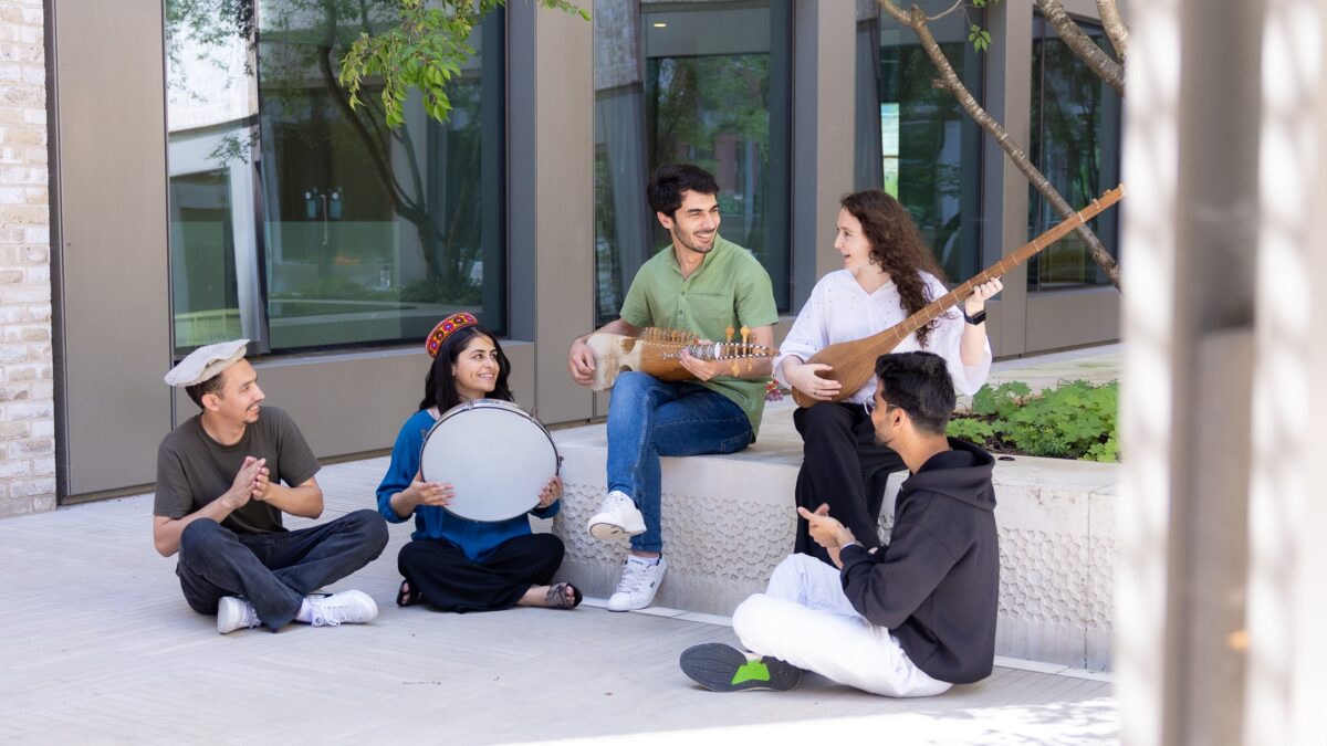 STEP students playing traditional instruments in the first floor garden at Victoria Halls.