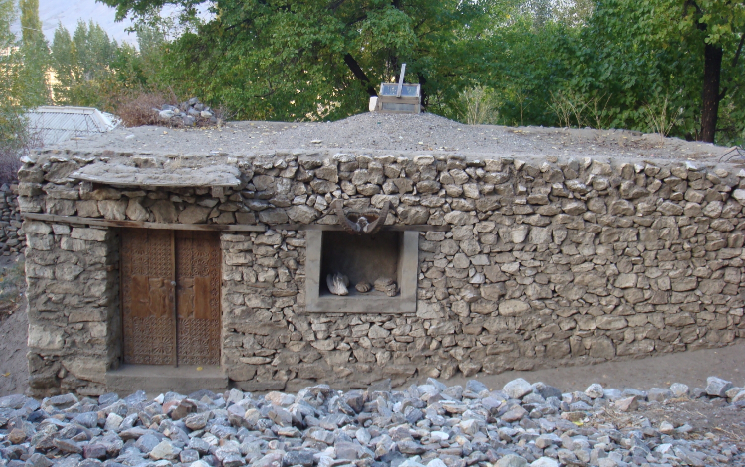 a stone wall with a door and a window