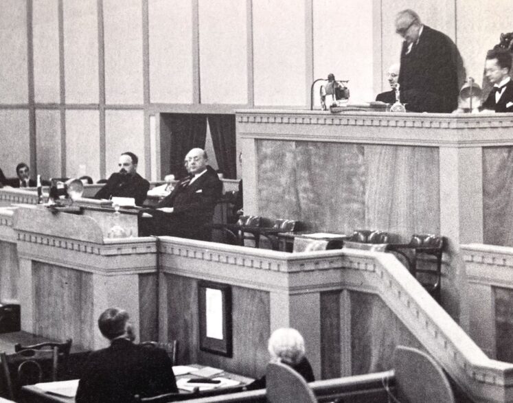 Aga Khan III seen addressing the League of Nations Assembly at the Palace of Nations during his term as President of the League.