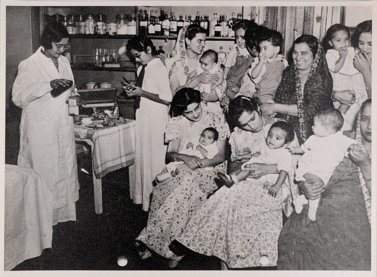 a group of women and children in a room