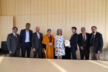 Members of the Keshavjee family present artefacts to the IIS