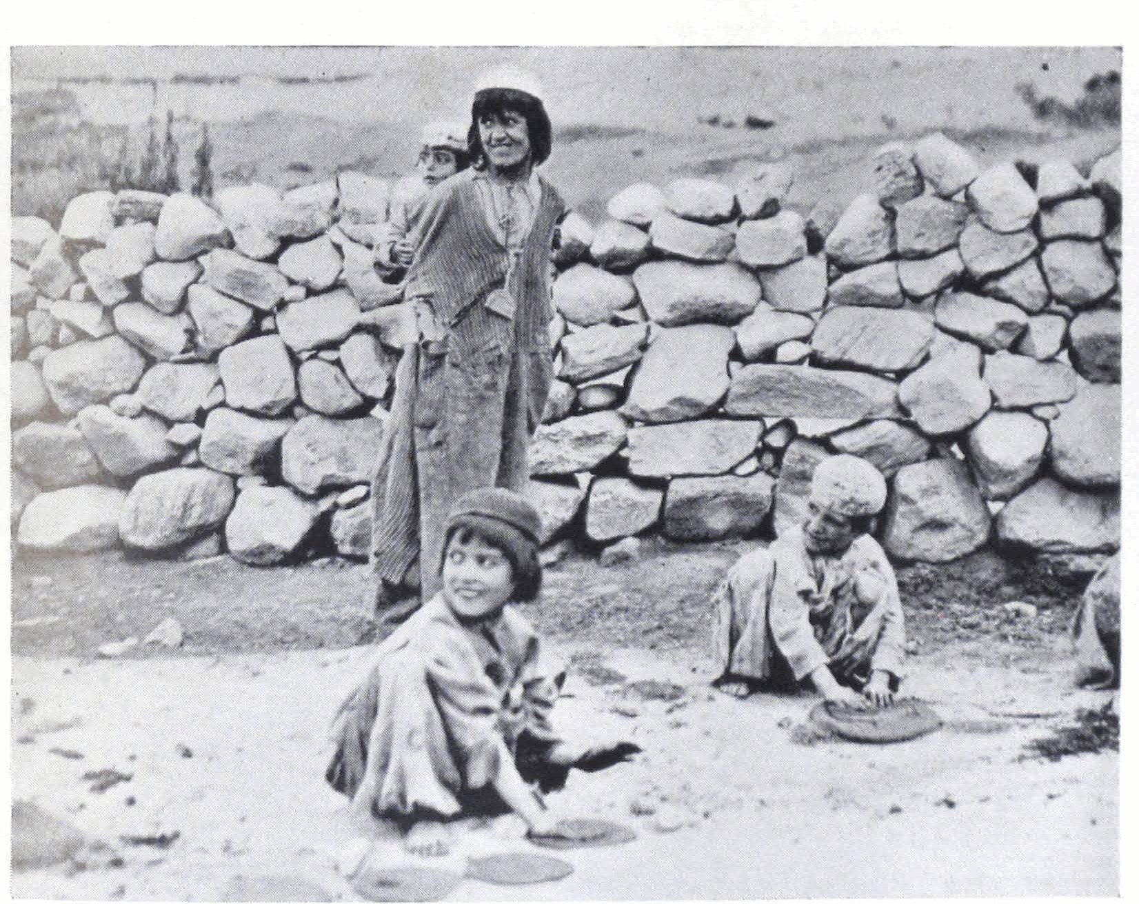 ‘Hunza children playing with mud’