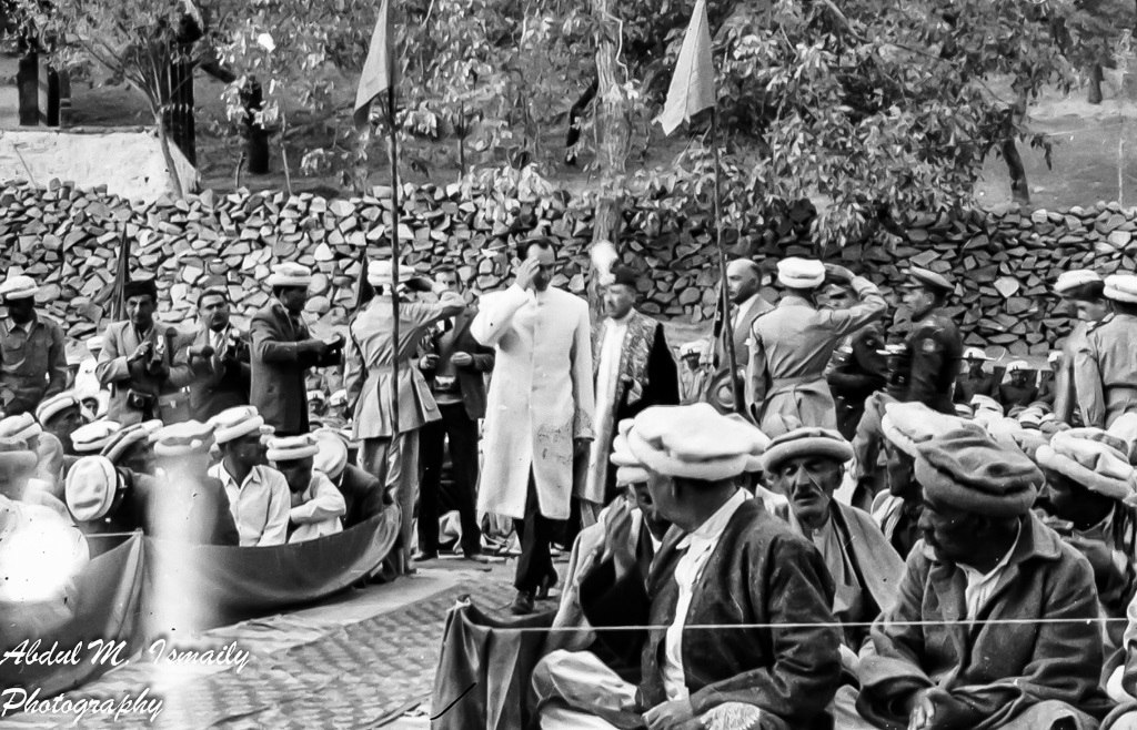 His Highness Prince Karim Aga Khan IV salutes in response to volunteers greeting him