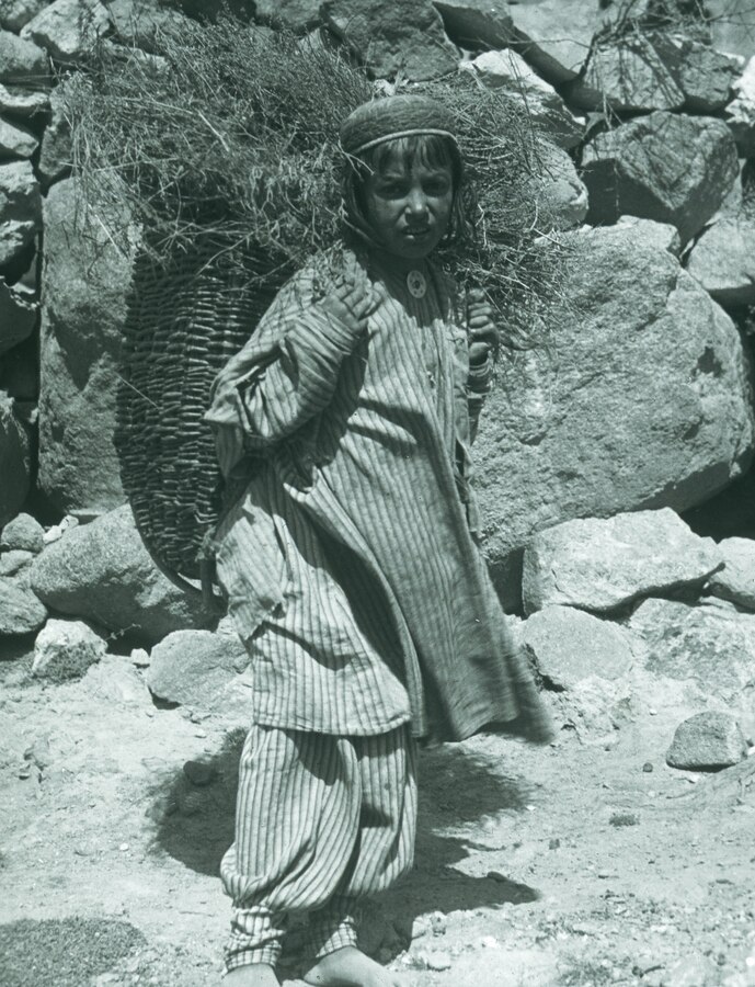 Hunza District, girl with grass