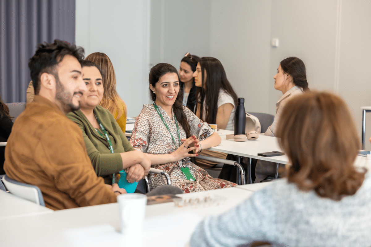 a group of people sitting at tables