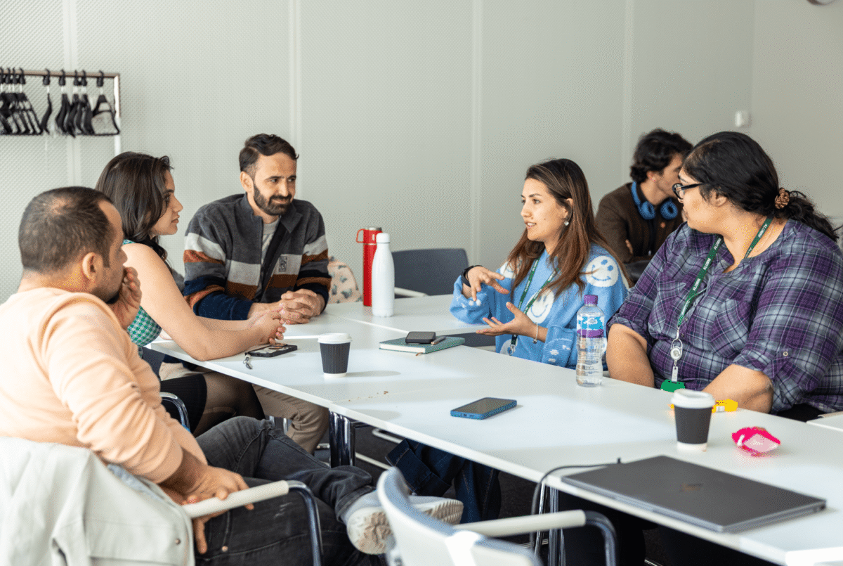 a group of people sitting at a table
