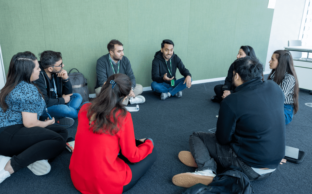 a group of people sitting on the floor