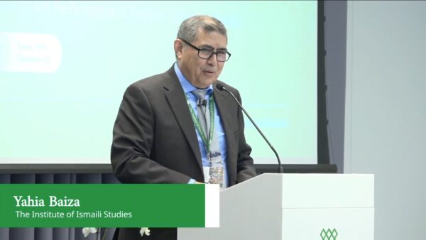 Man presenting at a conference.