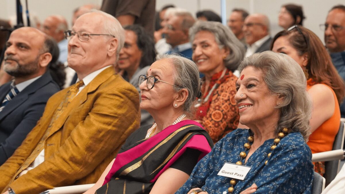 Audience attentively watching a presentation at Merchant Ivory film screening