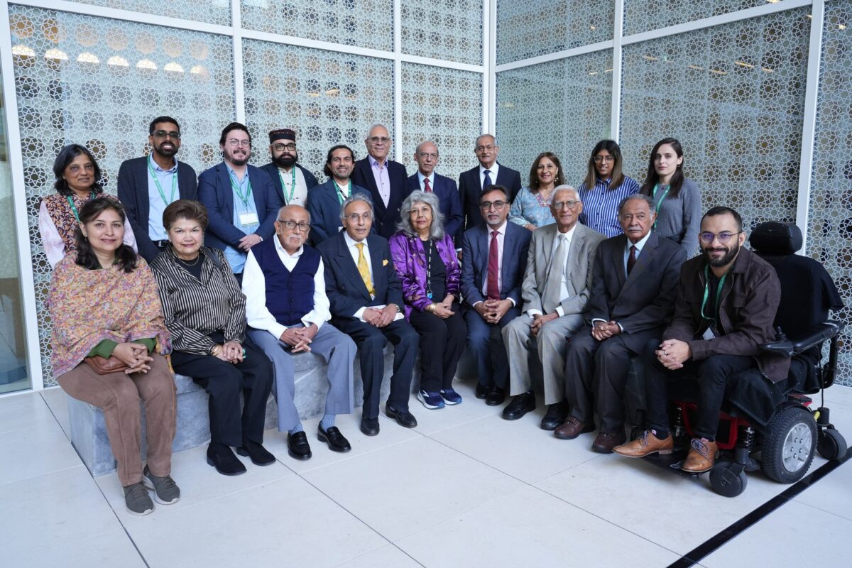 Diverse group posing for conference photo.