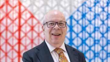Man in suit with patterned tie.