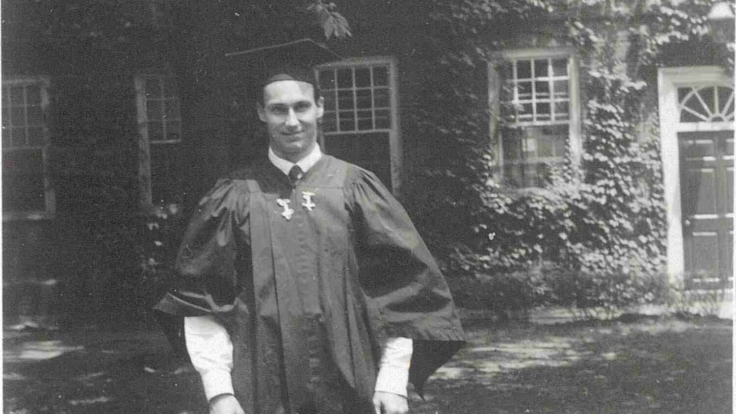 His Late Highness Aga Khan IV at his Harvard University Graduation, wearing academic gown. Ismaili Special Collections