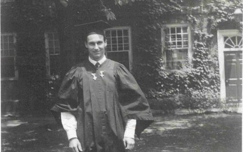 His Late Highness Aga Khan IV at his Harvard University Graduation, wearing academic gown. Ismaili Special Collections