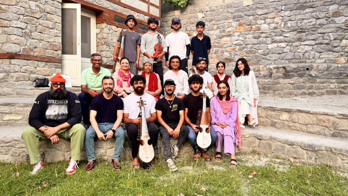 IIS delegation standing with local community leaders.