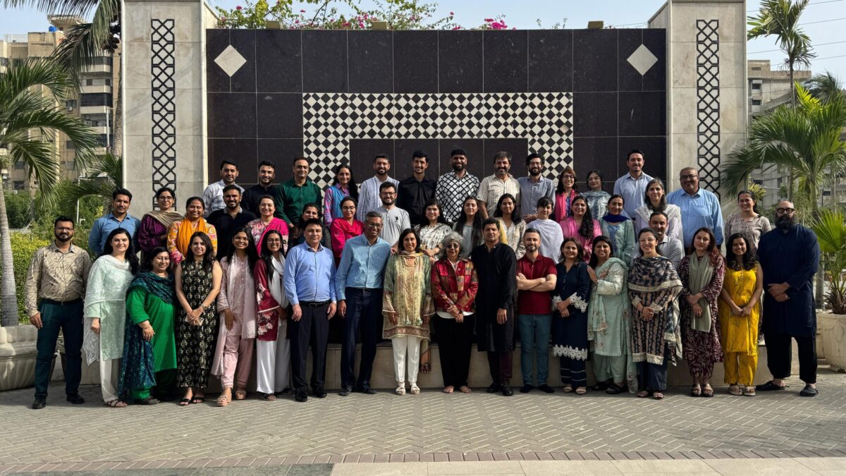 Large group photo with IIS delegation and STEP educators in Karachi.