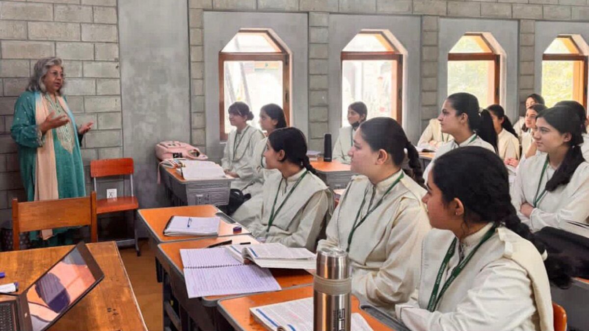 Professor Zayn Kassam speaking to students in Aga Khan School Hunza classroom.