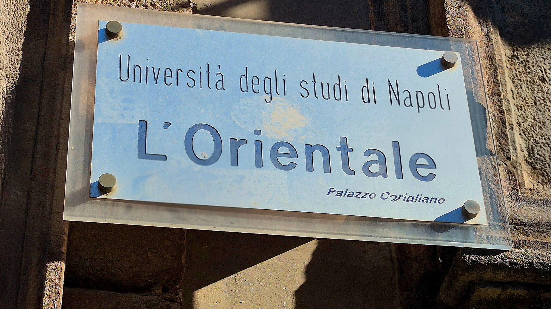 Sign for L Orientale University of Naples on an exterior wall