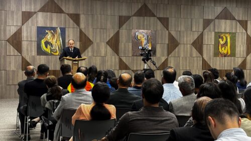IIS scholar addressing a community audience during a United States visit