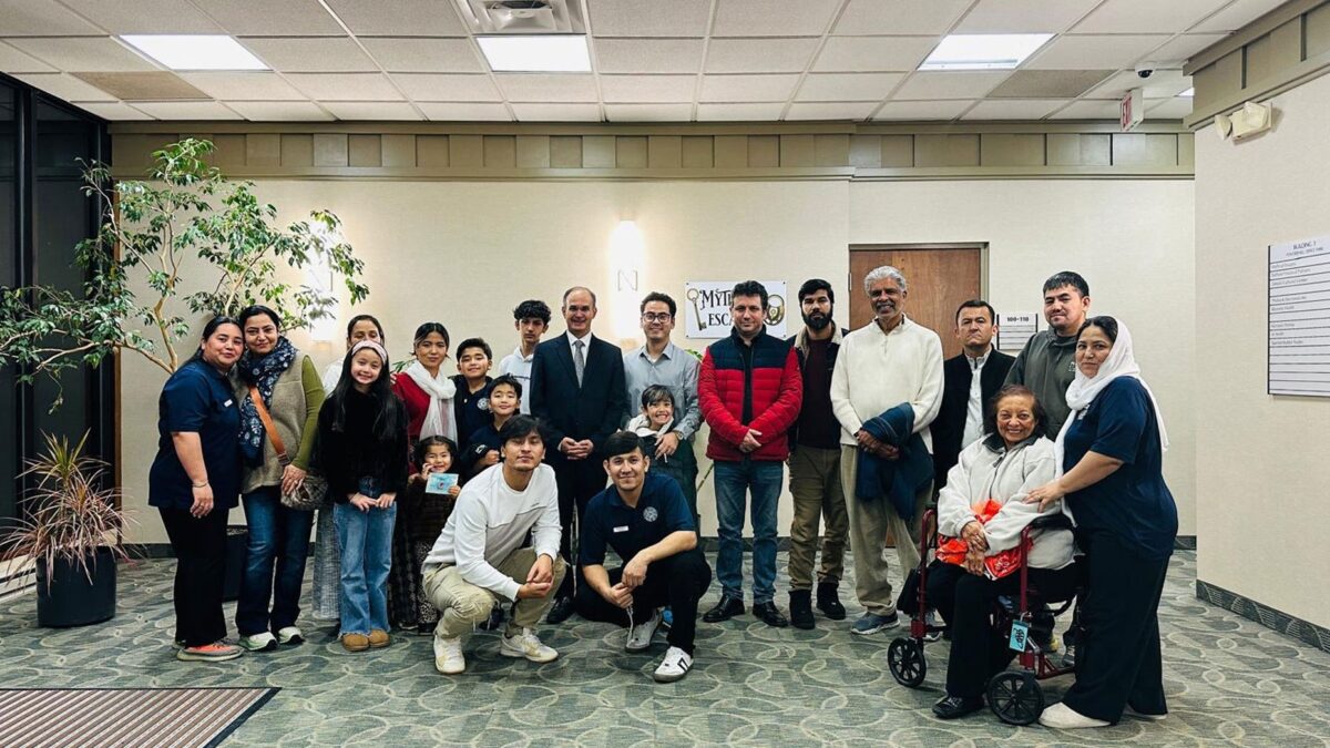 IIS scholar with community members following a Jamati session in the United States