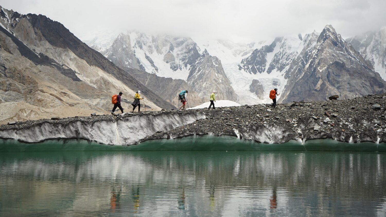Hikers crossing a glacial landscape. Voices connected