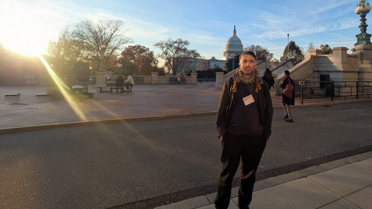 An IIS scholar stands outdoors near the United States Capitol building during an international academic conference. The image relates to research engagement on Fatimid Sicily and Mediterranean history.