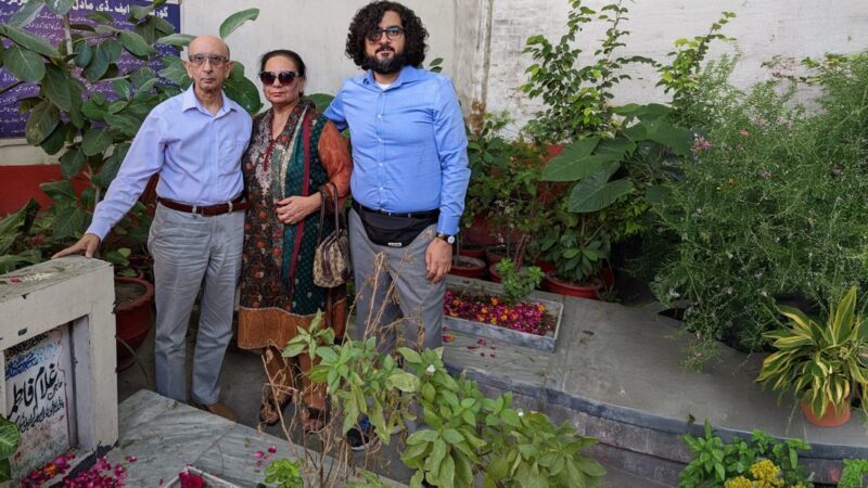 Visitors standing near the graveyard of Vazir Saheba Fatima