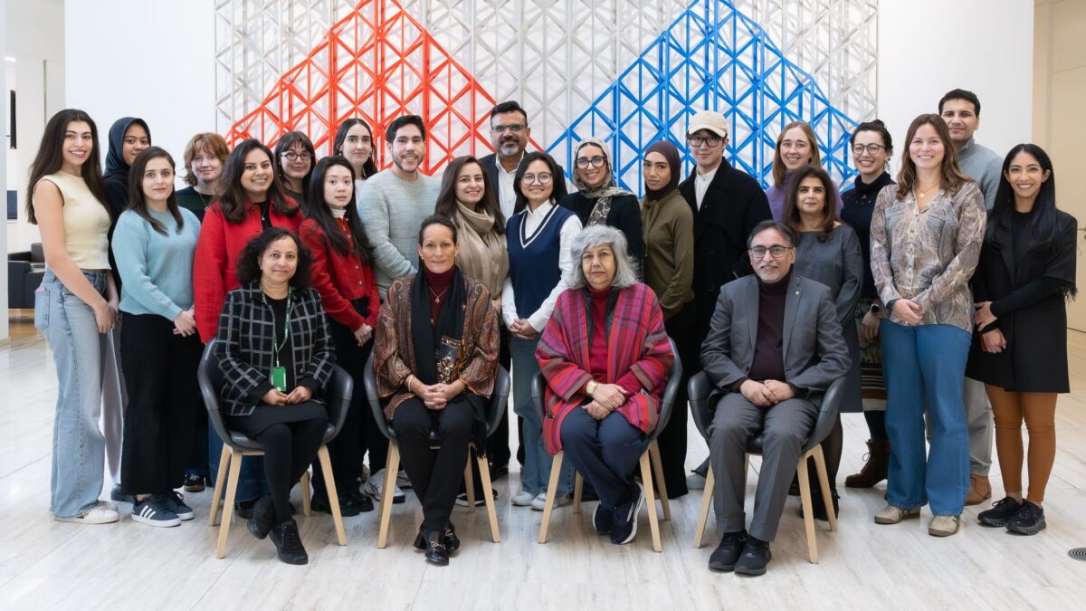 UCL IIS Diverse group posing in modern setting.