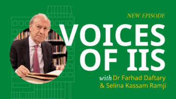 Farhad Daftary speaks during a recorded Voices of IIS interview, seated across from a host with microphones in a studio setting at the Aga Khan Centre.