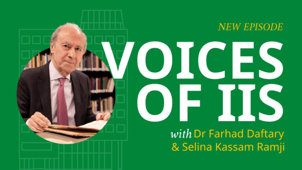 Farhad Daftary speaks during a recorded Voices of IIS interview, seated across from a host with microphones in a studio setting at the Aga Khan Centre.