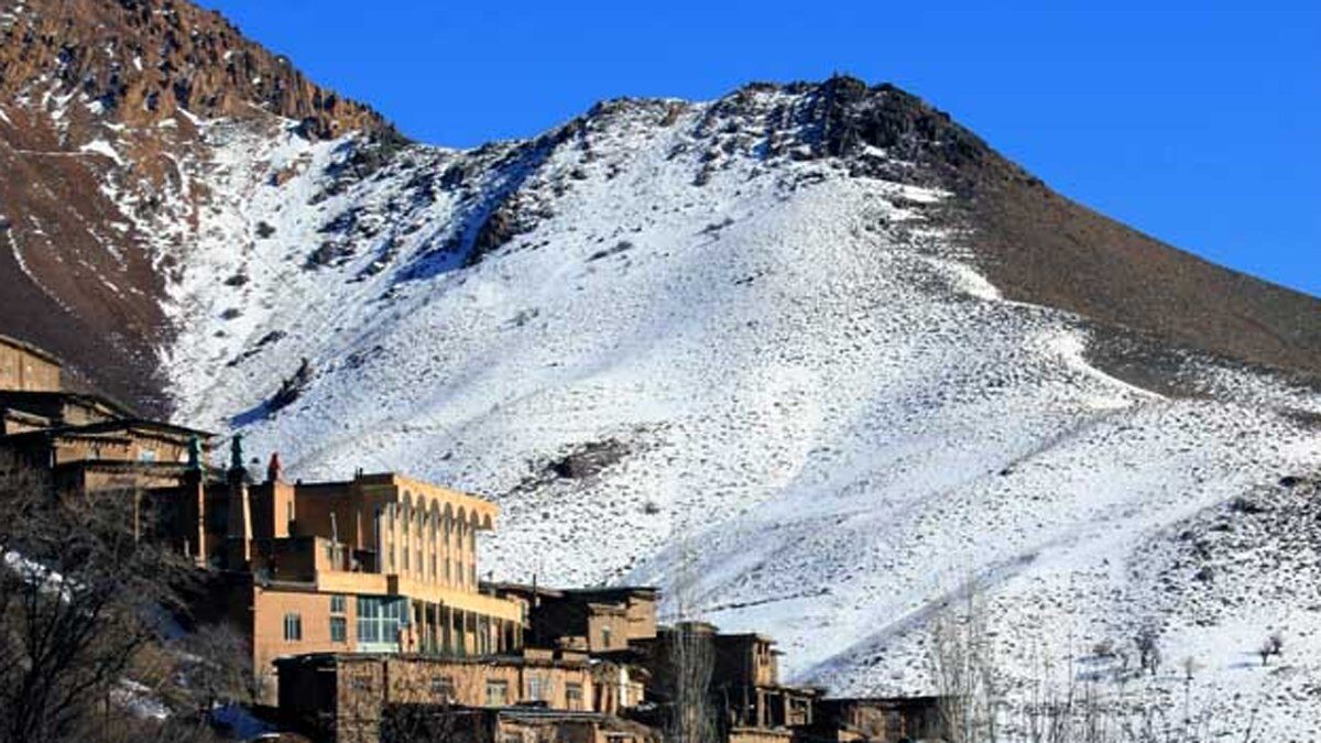 Snow-covered mountains above Dizbad village in Iran