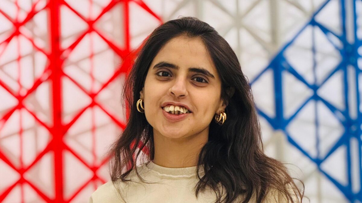 Anooshey Abid posing in front of Art Installation